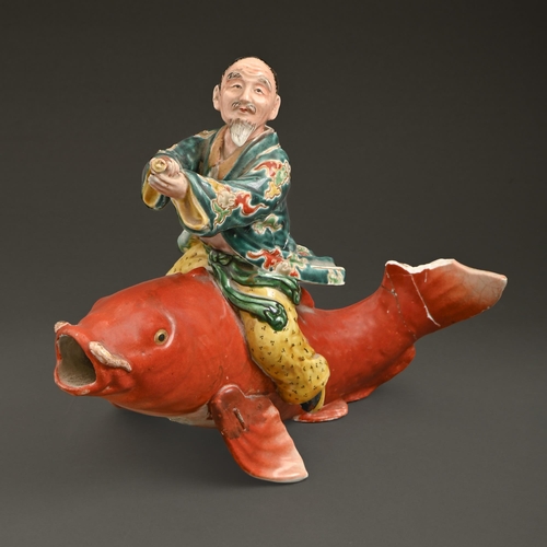 543 - A Chinese porcelain figure of Qin Gao riding a carp, Qing dynasty, 19th c, 20cm h