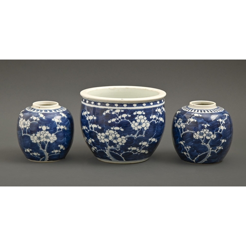 547 - A Chinese blue and white prunus on cracked ice jardiniere and a pair of ginger jars, 19th / 20th c, ... 