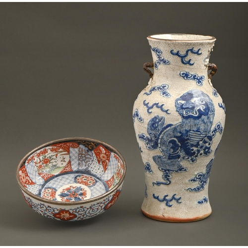 548 - A Chinese moulded and crackle glazed blue and white vase, c1900, 35cm h and a Japanese Imari bowl, e... 