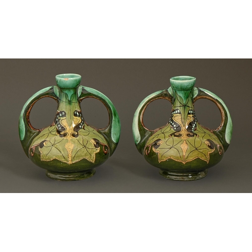 554 - A pair of Purmerend Art Nouveau earthenware vases, c1900, painted in a green, olive and turquoise pa... 