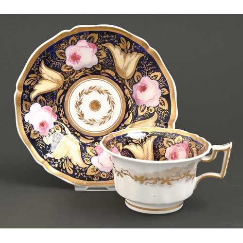 565 - A Rockingham teacup and saucer, c1826-1835, of square handle shape, painted in a richly gilt set pat... 