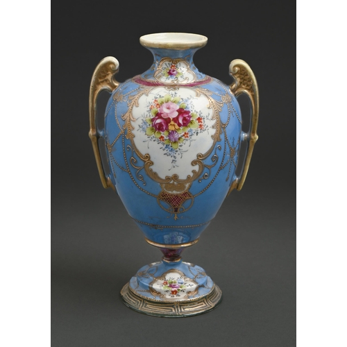 600 - A Japanese porcelain vase, early 20th c, painted with flowers in raised gilt reserves on a blue grou... 