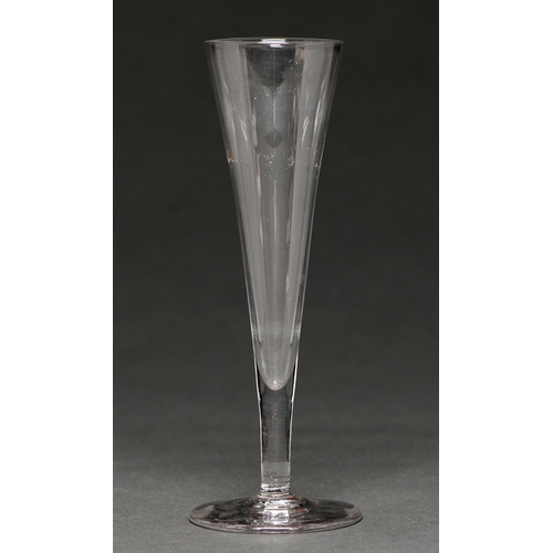 660 - An English ale glass, c1780, the plain conical bowl on solid stem and plain foot, 18cm h... 