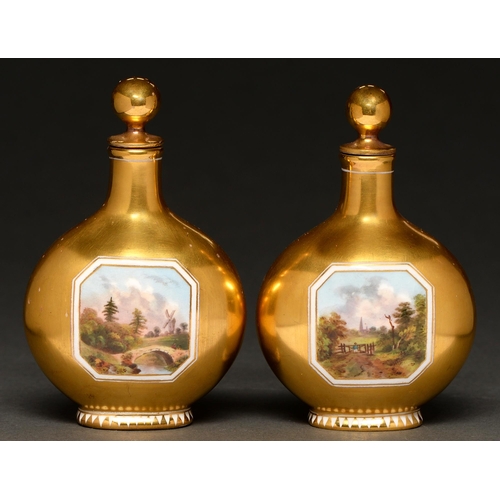 670 - A pair of Coalport gilt ground scent bottles and stoppers of moonflask form, c.1880-90, painted to e... 