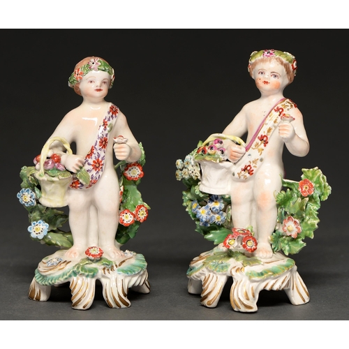 709 - Two Bow figures of a child with a basket of flowers, c1770, naked save for a chaplet and sash, 13 an... 