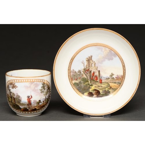 715 - A Meissen, Marcolini cup and saucer, c1800, painted with battle scenes, in gilt reserve, saucer 13.3... 