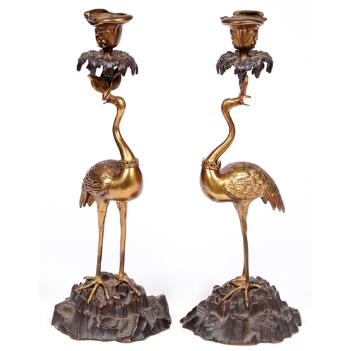 803 - A pair of French gilt and patinated bronze crane candlesticks, late 19th c, the gilt bird gorged of ... 