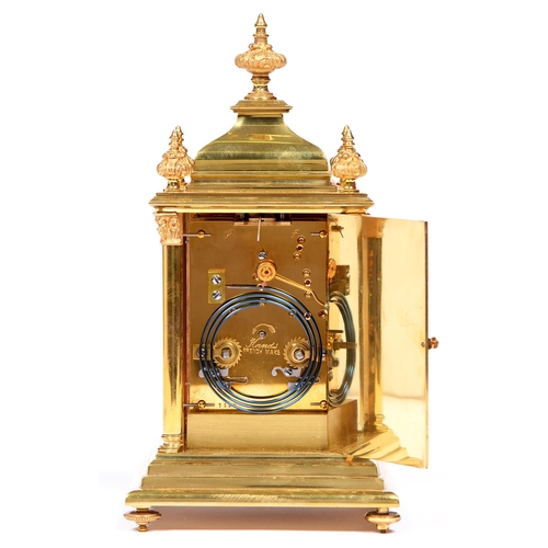 842 - A French brass and champleve enamel carriage clock, early 20th c, with pillars, finials and ogee dom... 