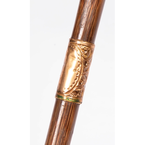 852 - A Victorian bamboo walking stick, with embossed giltmetal mounts, 84cm l