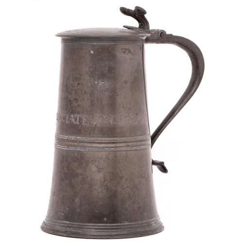 855 - A Scottish George II pewter communion flagon, of plain tapered form but for moulded girdle and bifur... 