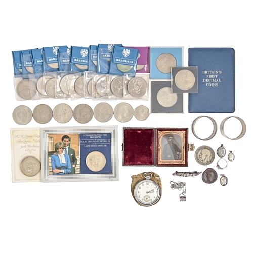 943 - Miscellaneous items, including an Oris pocket watch, silver napkin rings, commemorative crowns and o... 