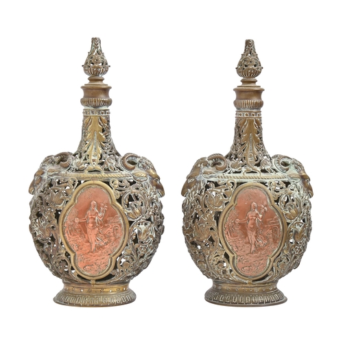 944 - A pair of French cast brass openwork pilgrim bottles and stoppers, late 19th c, with ram's head shou... 