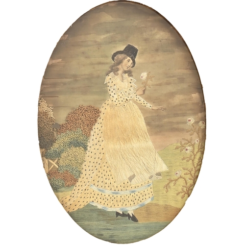 969 - A George III silk needlework picture of a young lady picking flowers, in oval giltwood and compositi... 