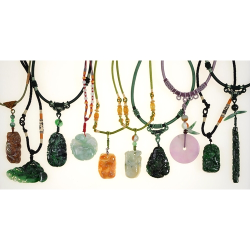 97 - Miscellaneous Chinese carved jade pendants and hardstone beads on silk covered necklaces, late 20th ... 