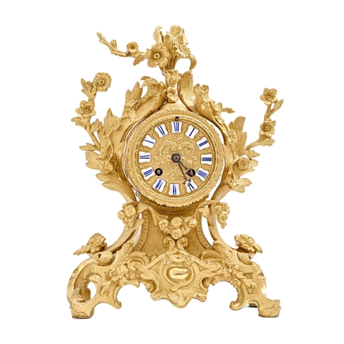 974 - A French gilt brass mantel clock, third quarter 19th c, the drum cased bell striking movement with e... 