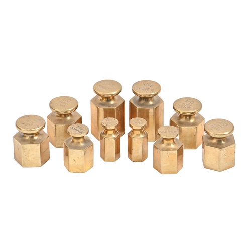 976 - Ten hexagonal brass banker's coin weights, post-1971