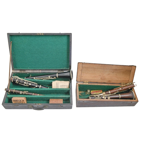 981 - Musical instruments, comprising a French three piece ebony clarinet, another similar, rosewood, etc ... 