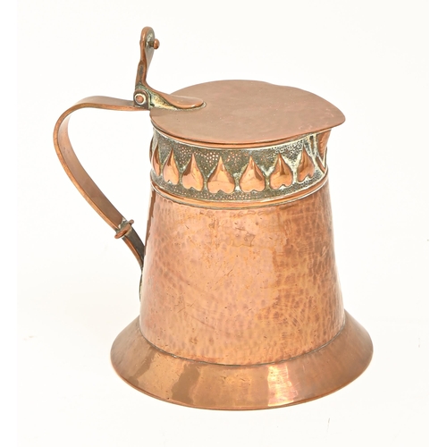 988 - An Arts & Crafts copper lidded jug, Keswick School of Industrial Arts, c1900, the design attribu... 