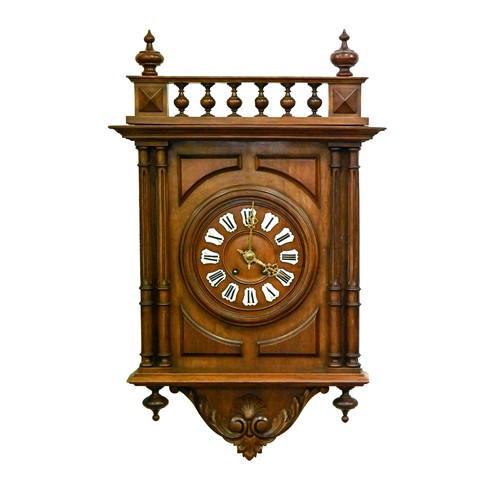 1441 - A German walnut wall clock, the dial with enamelled chapters, 60 x 41cm, key and pendulum... 