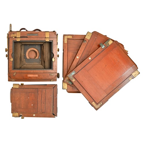 904 - An English mahogany and brass folding plate camera, The New King, c1902, half plate, with trade labe... 