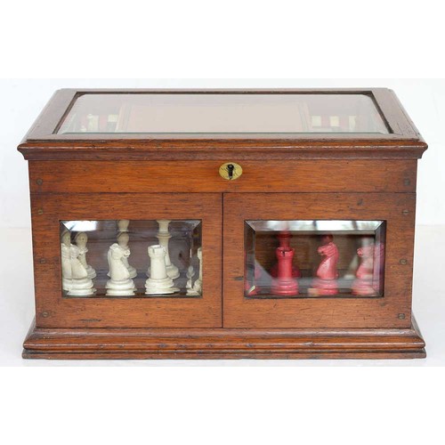 945 - A Victorian oak games compendium, Royal Cabinet of Games, the lid with bevelled glazed light and enc... 