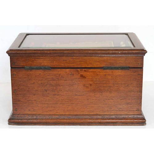 945 - A Victorian oak games compendium, Royal Cabinet of Games, the lid with bevelled glazed light and enc... 