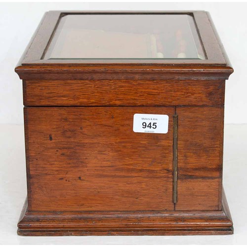 945 - A Victorian oak games compendium, Royal Cabinet of Games, the lid with bevelled glazed light and enc... 