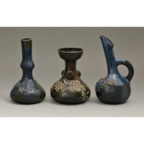 843 - A group of Elton ware, comprising a Peace mug dated 1918, hand candlestick, ewers and vases, one of ... 