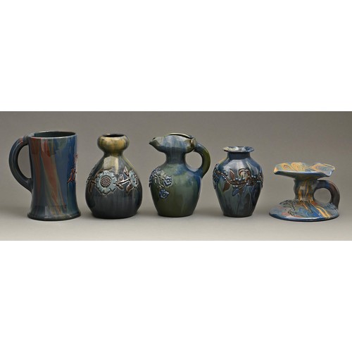 843 - A group of Elton ware, comprising a Peace mug dated 1918, hand candlestick, ewers and vases, one of ... 