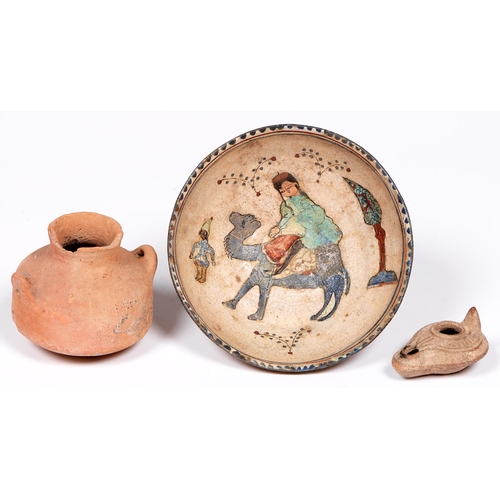 1068 - A Persian earthenware bowl, the painted and glazed interior with a figure on a camel, 17cm diam, a R... 