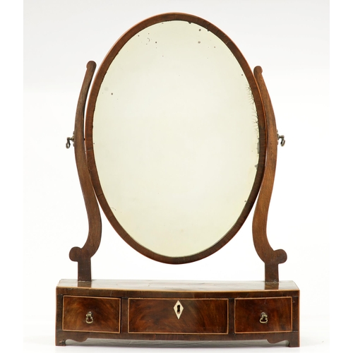 1200 - A George III mahogany dressing mirror, with oval plate and bow fronted base, 41.5cm l... 