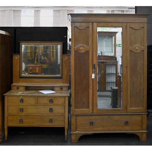 1215 - An oak two-piece bedroom suite, early 20th c, wardrobe 202cm h; 167cm l