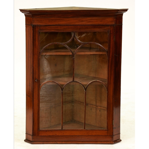 1220 - A George III mahogany hanging corner cupboard, with arch patterned glazing bars to the door, 109cm h... 