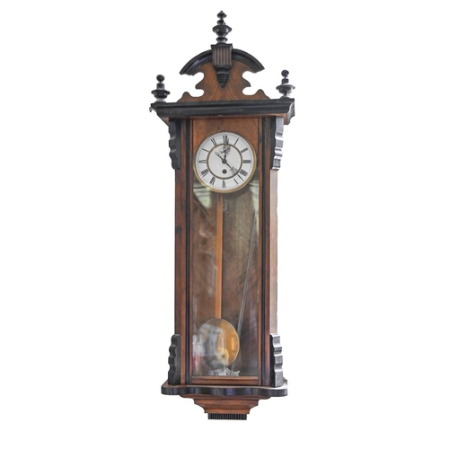 1016 - A  walnut and ebonised Vienna wall timepiece, c1900,  with enamel dial, 117cm h