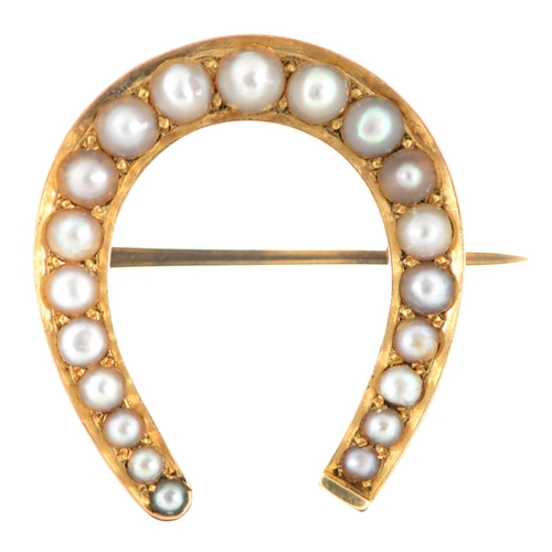 115 - A split pearl horseshoe brooch, c1900, in gold, 31mm, 5.2g