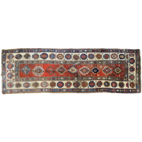 1210 - An antique Caucasian runner, 110 x 335cm