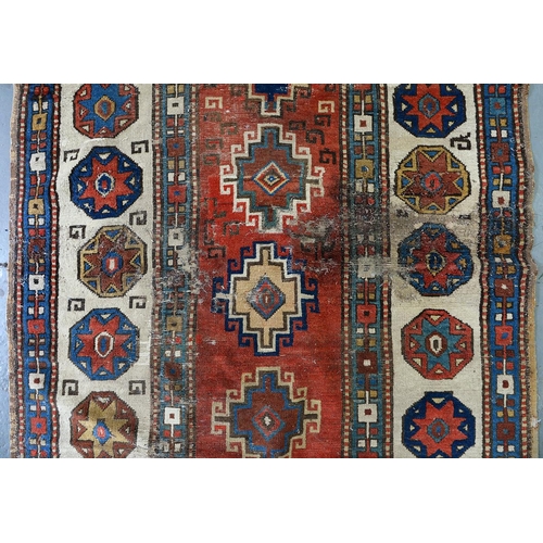 1210 - An antique Caucasian runner, 110 x 335cm