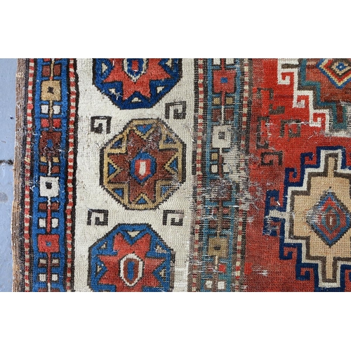 1210 - An antique Caucasian runner, 110 x 335cm