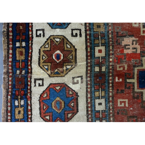 1210 - An antique Caucasian runner, 110 x 335cm