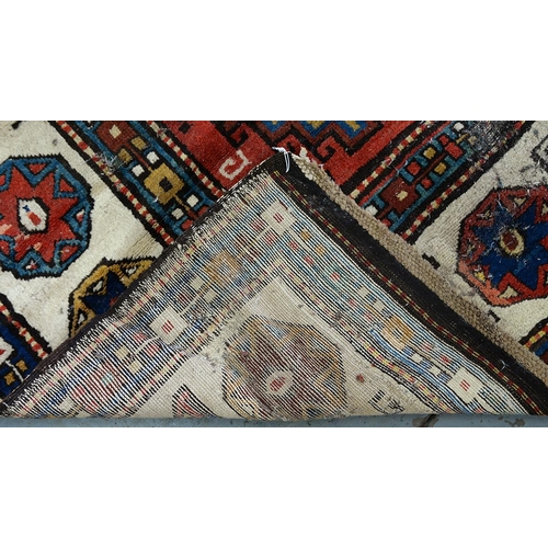 1210 - An antique Caucasian runner, 110 x 335cm