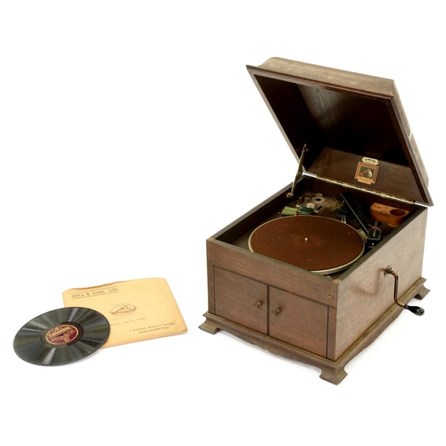 1233 - An oak table gramophone, His Masterps Voice Model 127, 1926,  52cm l, retailer's ivorine trade label... 