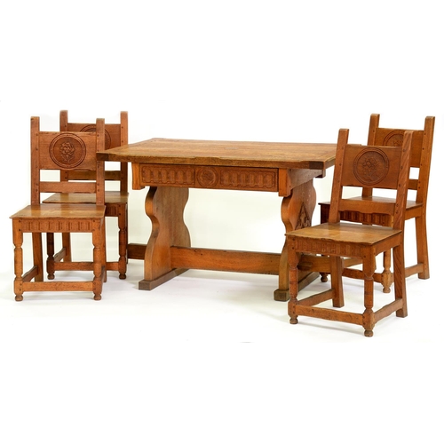 1254 - An English Arts & Crafts oak dining table and four chairs, c1950,  the table with cleated ends a... 