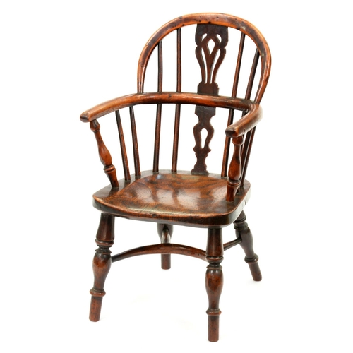 1258 - A Victorian yew wood child's Windsor chair, East Midlands Region, with crinoline stretcher, elm seat... 