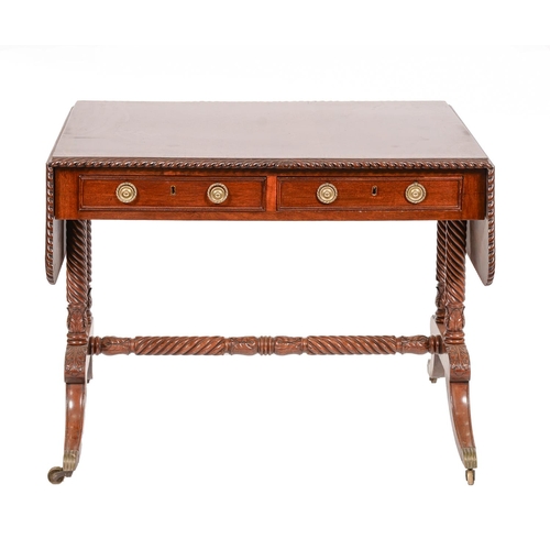 1294 - A William IV mahogany sofa table, the top crossbanded in rosewood within gadroon carved lip, brass c... 