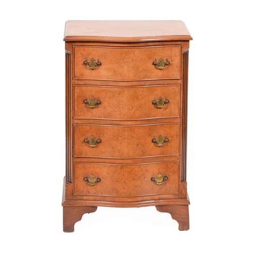 1296 - A reproduction serpentine walnut and burr walnut chest of drawers, 75cm h; 47.5cm l