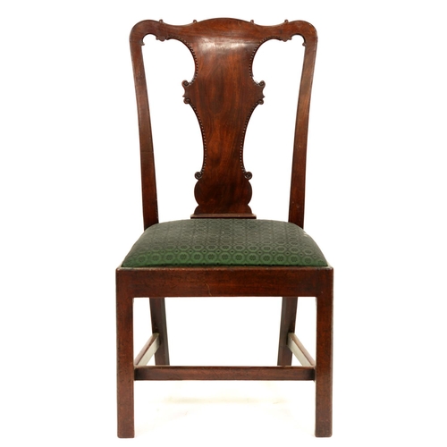 1318 - A George II walnut chair, the solid splat with notched outline and volutes, on square legs, 100cm h... 