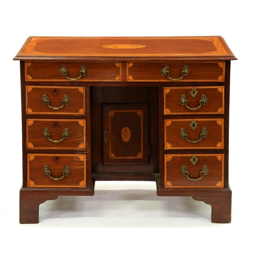 1346 - A Victorian inlaid mahogany kneehole dressing table, crossbanded in satinwood with fan spandrels and... 