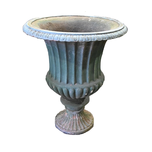 1365 - A Victorian cast iron garden vase,  of campana shape on fluted round foot, 69cm h, 58cm diam... 