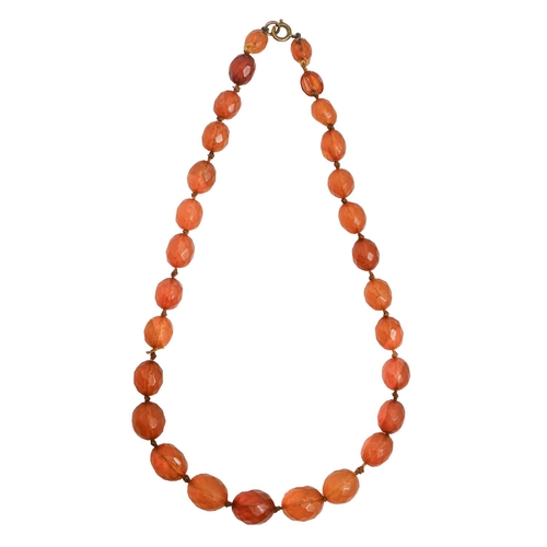 184 - A necklace of faceted amber beads, c1920, 48cm l