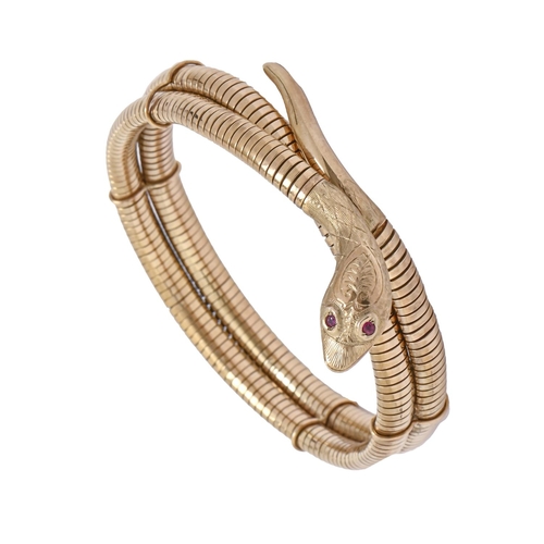 190 - A 9ct gold serpent bangle, with red stone eyes, flexible, approx 66mm diam (internal), by Smith &... 